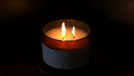 4k, slow mo, three candles burning with dark background
