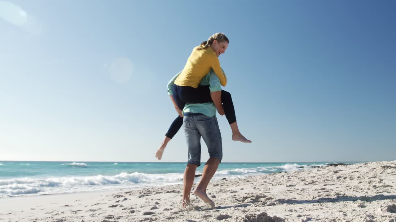 Couple in love enjoying free time on the beach together