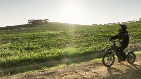 a person riding a dirt bike on a dirt track