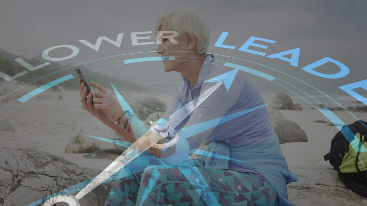 woman exploring navigation app on smartphone at beach showing compass and POWER LEADER graphics