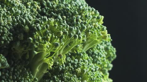 rotating broccoli and smoke on black background
