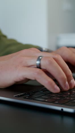 person typing on a laptop