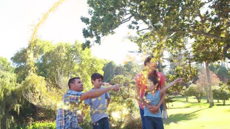 animation of light spots over caucasian family spending time in park together