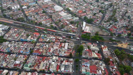 Aerial-birds-eye-view-Salvador-Diaz-neighborhood-house-buildings-with-road-traffic