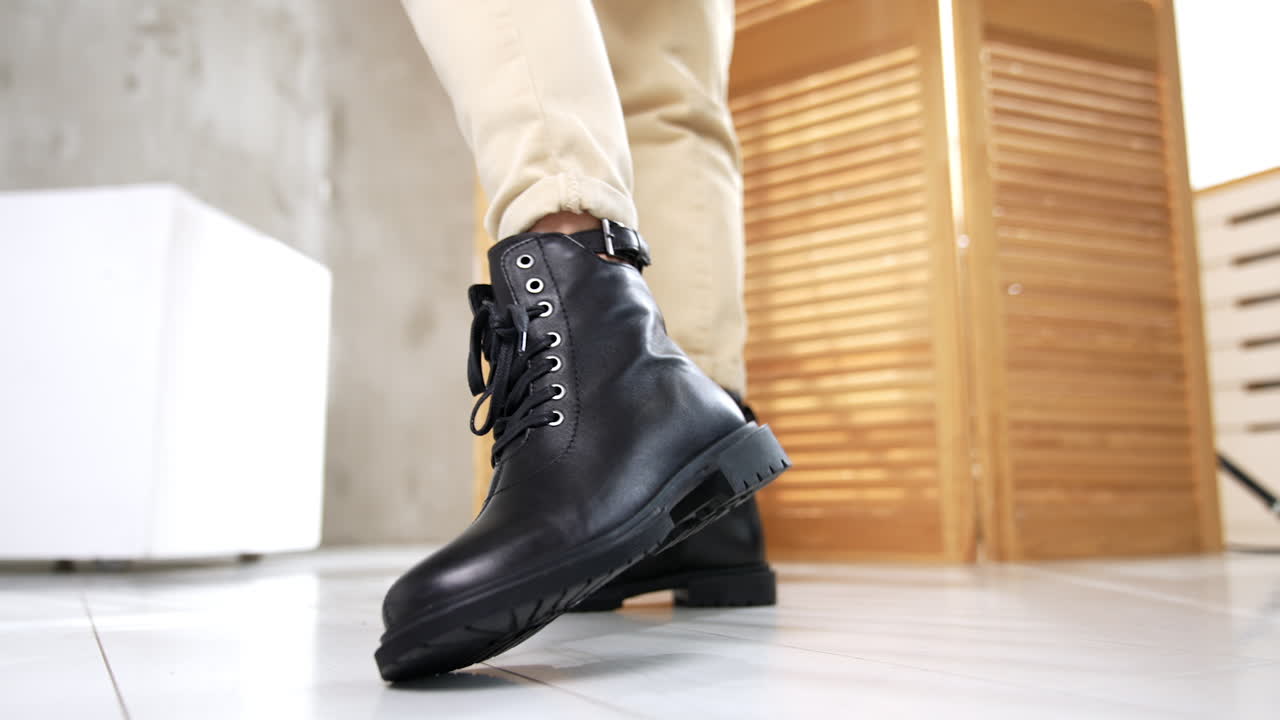 Woman wearing black leather boots