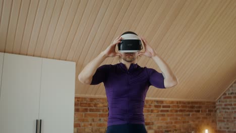 man using vr headset for virtual cycling workout at home