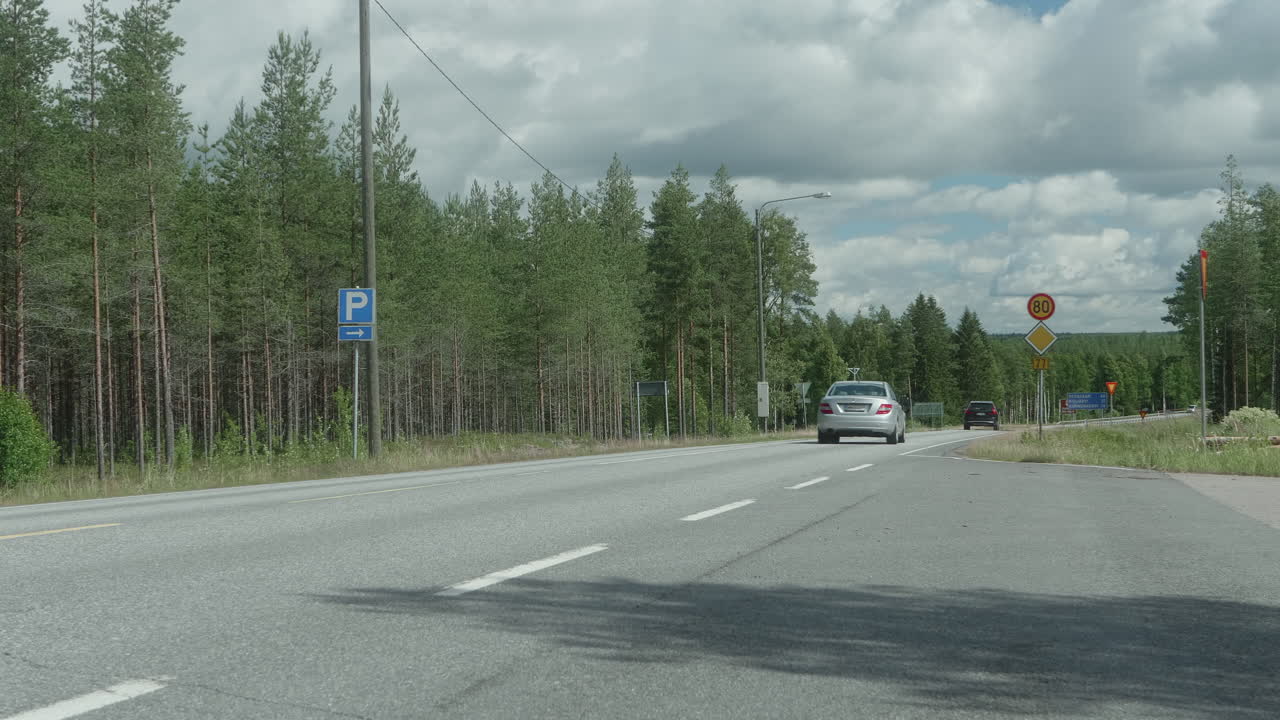 Traffic on the Countryside in Finland, Near Kyyj&auml;rvi, Sunny Day, Cars Passing By