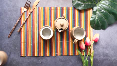 tableware arrangement with tea set and flowers