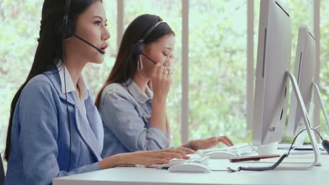 customer support agent or call center with headset talking to customer on phone.