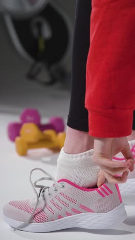 vertical shot of girl packing gym bag