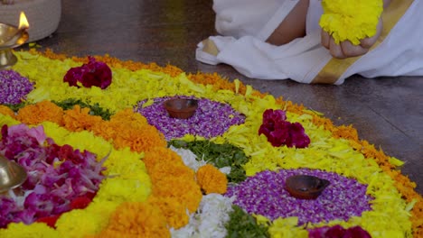 athapookkalam decorating for onam festival in kerala ,pookalam decorating kerala traditional family for onam celebration