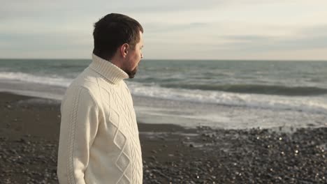 man contemplating on a beach
