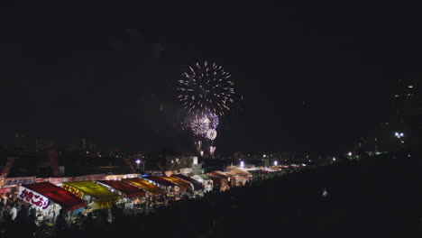 beautiful hanabi fireworks display at the yodogawa river in osaka, japan