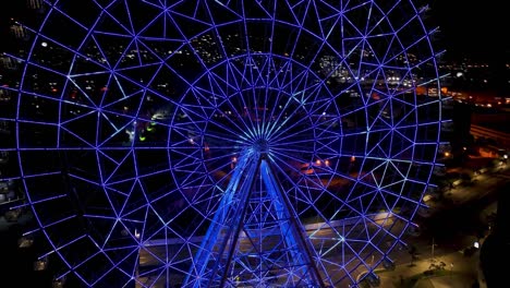 night panoramic landscape of illuminated ferris wheel at rio de janeiro brazil