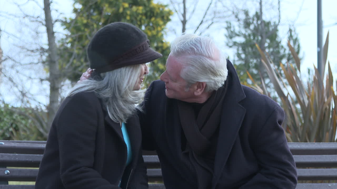 Elderly Couple Sharing a Moment in a Park