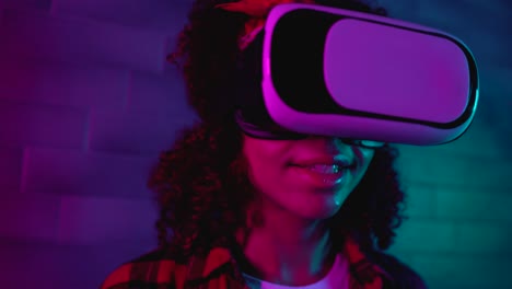 modern girl enjoying immersion in virtual reality in vr headset, technology