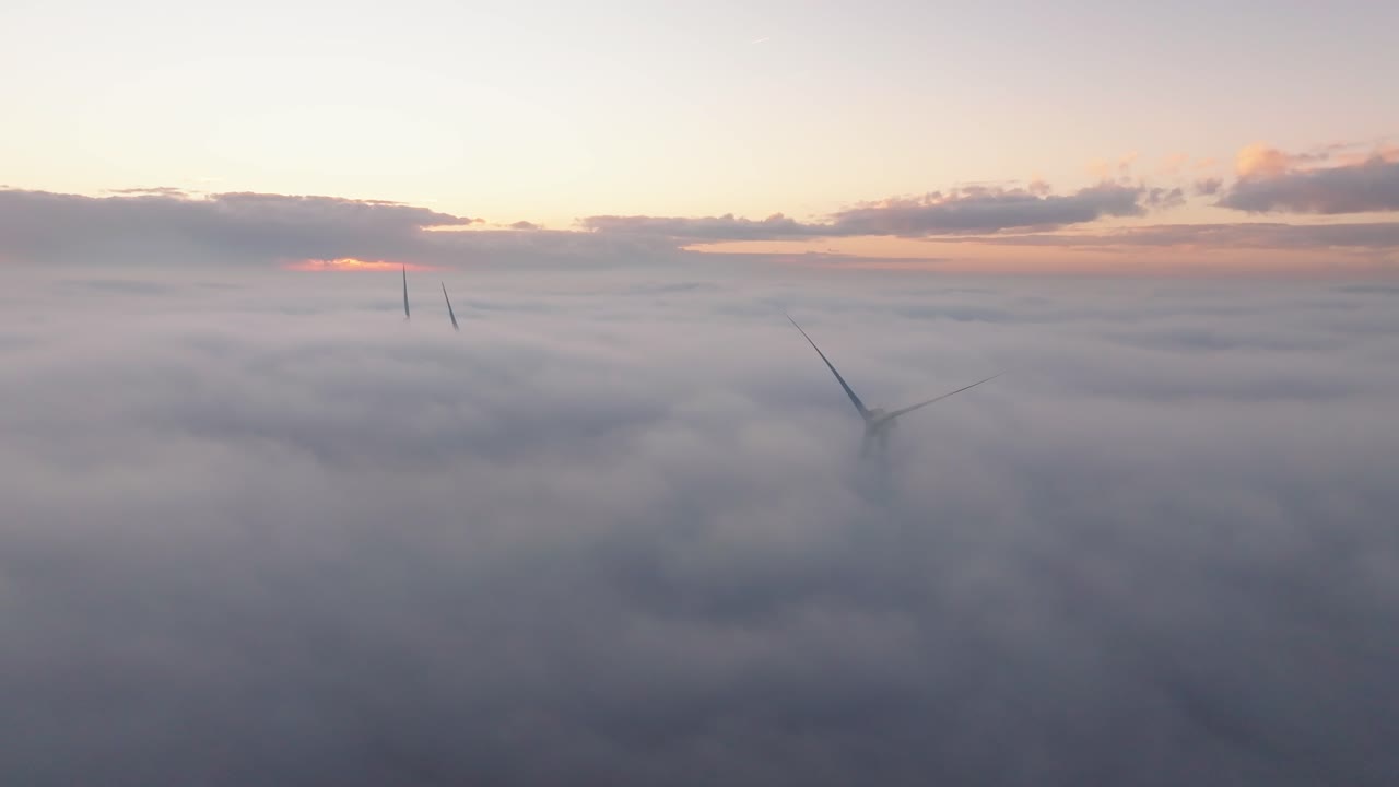 Drone shot of a Windturbine in foggy conditions