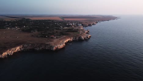 drone top down aerial view of waves splash against rocky seashore, background