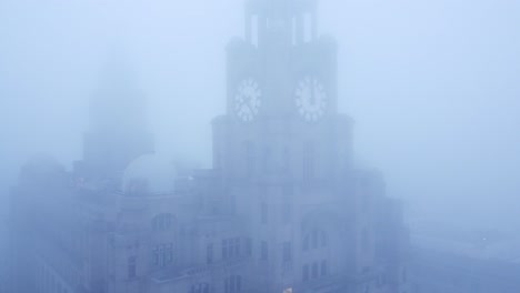 dense fog cover aerial view liverpool liver building in thick gloomy weather visibility pull away