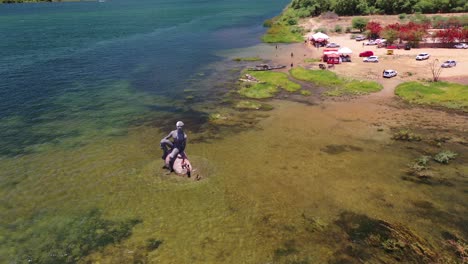 aerial view of a statue in a river