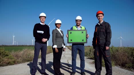 engineers with green screen