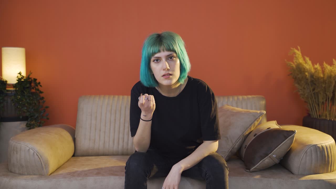 The young woman looking menacingly at the camera.