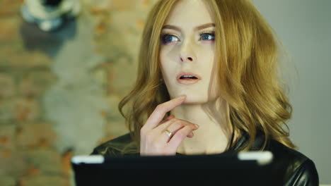 Model-Looks-Woman-Enjoying-A-Plate-In-A-Cafe-She-Is-Thoughtful-Thinking-About-Something