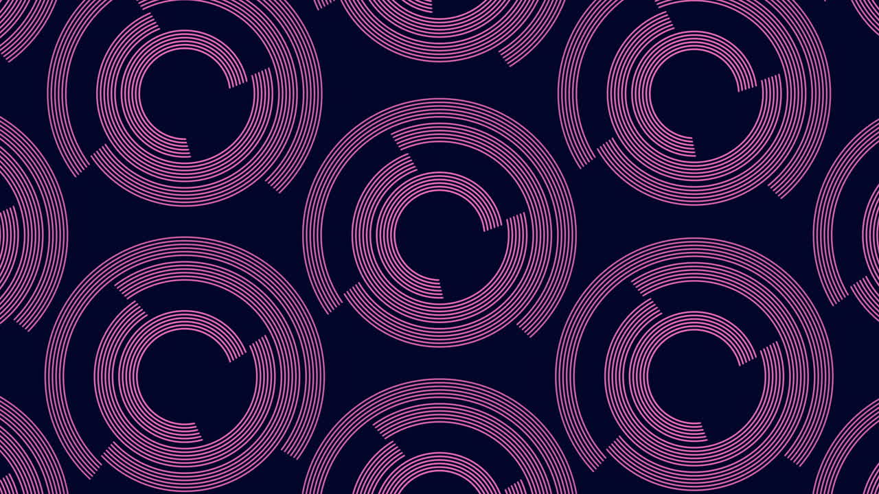 A mesmerizing spiral pattern featuring purple circles on a black backdrop. The circles range in size, forming a symmetrical design with smaller circles at the core and larger ones on the periphery