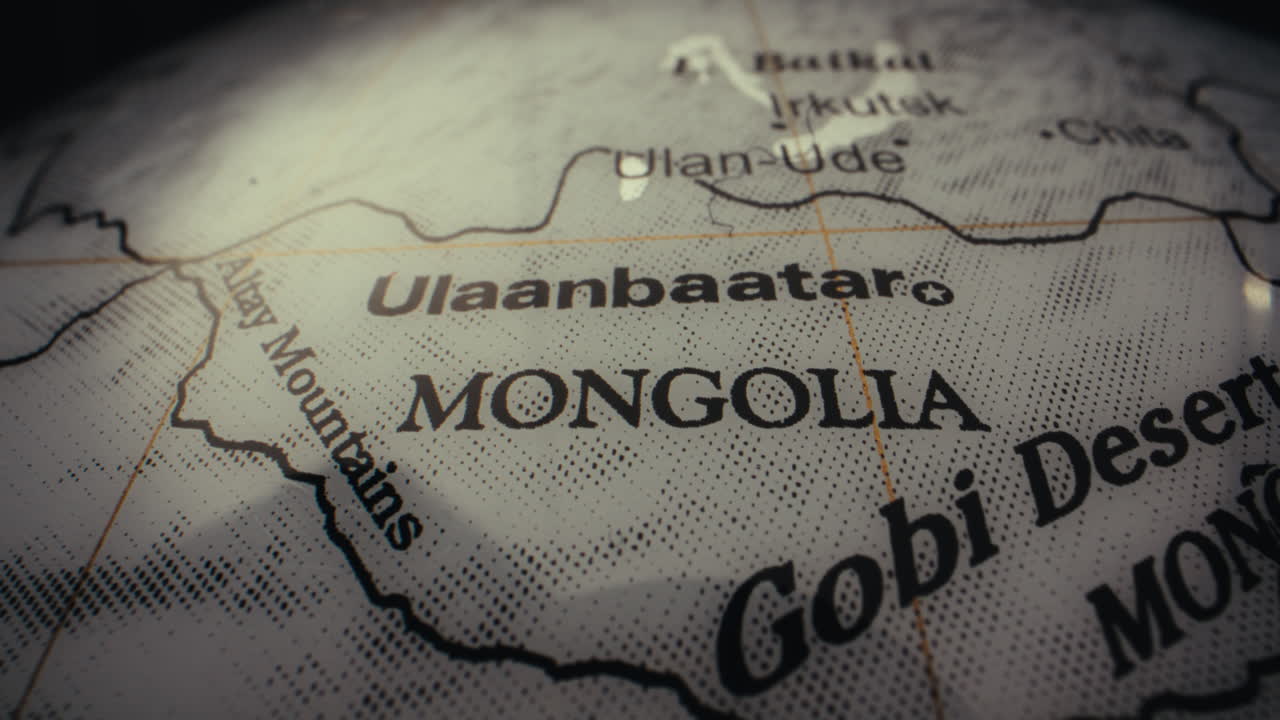 Close-up of a vintage world map focusing on Mongolia