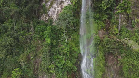 Cliff-aerial-rises-to-top-of-picturesque-waterfall-in-Honduras-jungle