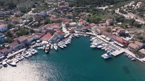 aerial view of a charming mediterranean village with marina and yachts