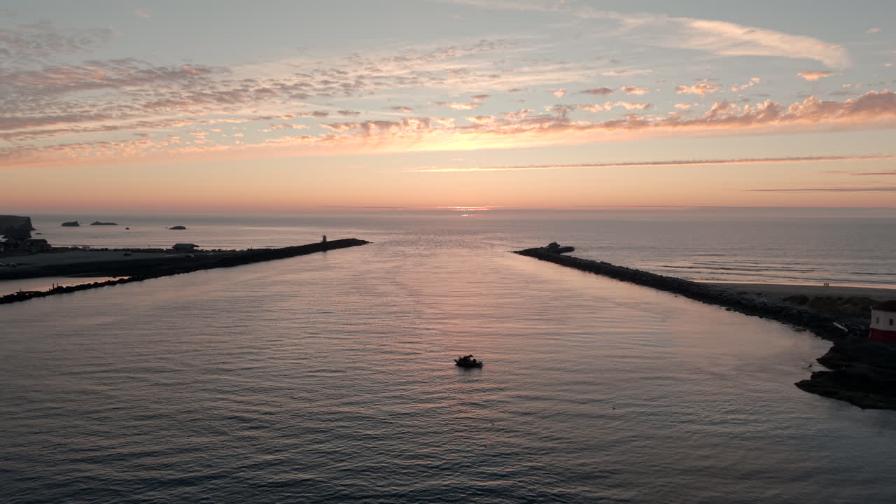 Coquille River Bandon Oregon Coast at sunset, aerial drone view with dramatic sky