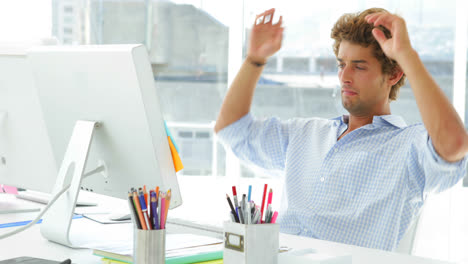 Content-businessman-reclining-on-his-swivel-chair-