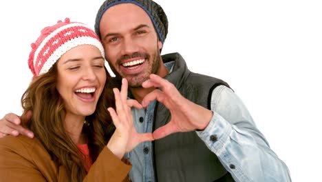 Young-couple-making-heart-with-hands