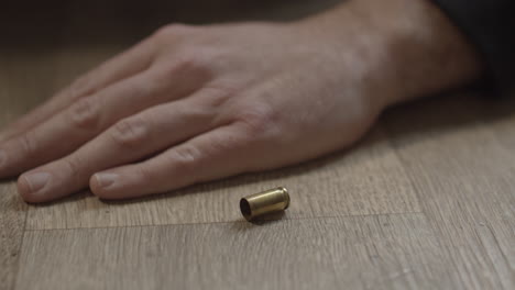 fired 9mm shell casing lying on the floor