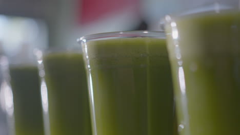 Close-Up-Low-Angle-of-a-Row-of-Green-Juices