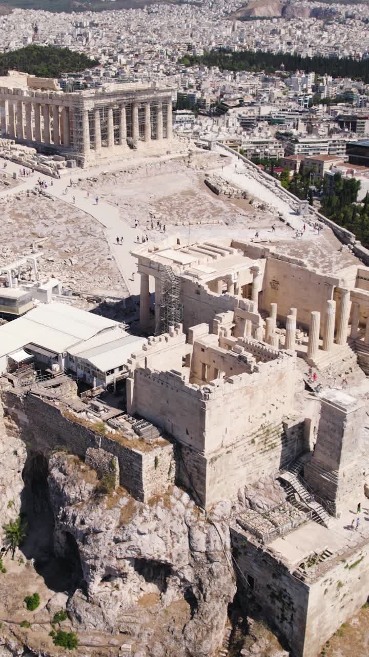 Ancient Acropolis ruins above city of Athens Greece, vertical video