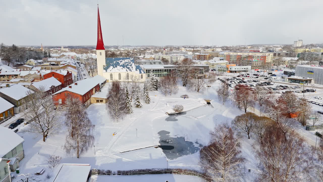 Aerial view around the Kirikupark, tilting toward the snowy church of Rakvere