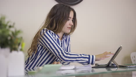 young woman working at home office