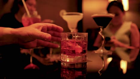 friends enjoying drinks at a stylish bar