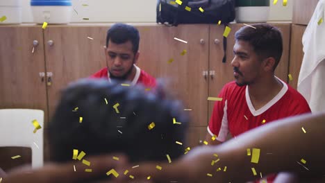 Animation-of-confetti-falling-over-male-football-players-in-changing-rooms