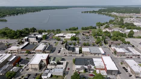 downtown cadillac, michigan with drone video moving right to left wide shot