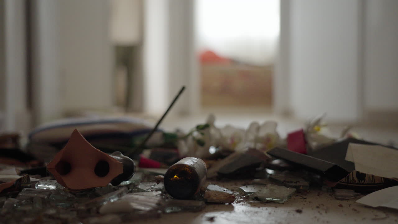 Destruction inside home in Kibbutz Nir Oz, Israel, broken glass and furniture