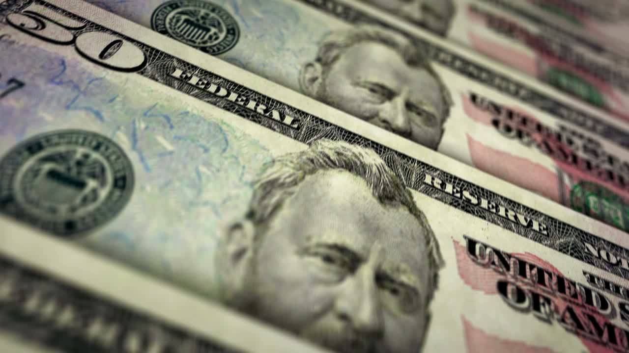 cincuenta billetes de dinero superficie del bucle del dólar animación