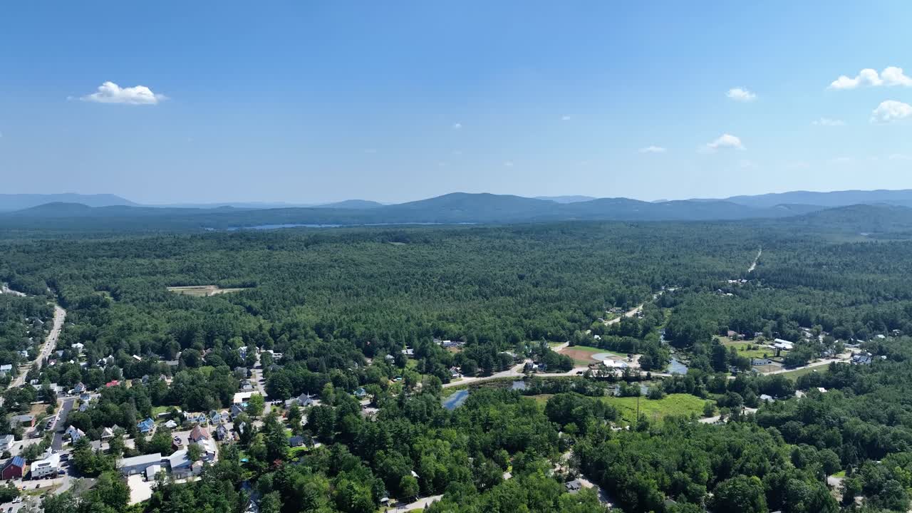 Aerial view of Conway, New Hampshire against the beautiful summer mountains