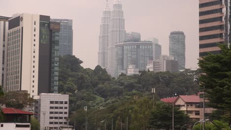 View-of-the-Petronas-Twin-Towers,-the-tallest-twin-buildings-in-the-world-in-Kuala-Lumpur,-Malaysia-skyline