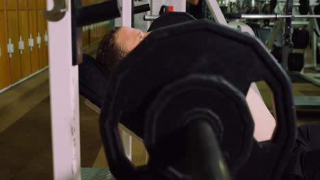 man lifting a heavy barbell