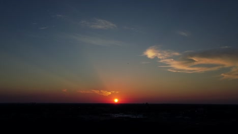 aerial drone view of beautiful sunset blue sky and few clouds with aeroplan flying in the sky