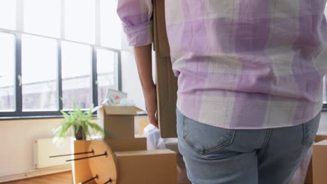 Tired-Asian-Woman-with-Stuff-Moving-to-New-Home.people,-repair-and-real-estate-concept--tired-asian-woman-with-stuff-moving-to-new-home