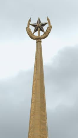 golden spire with star and crescent ornament